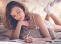 lifestyle soft image of pretty young woman sitting on her cozy Royalty Free Stock Photo