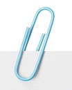 Close up of a light blue paper clip Royalty Free Stock Photo
