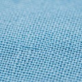 Close-up of a light blue woven fabric. The texture displays a grid-like pattern of Royalty Free Stock Photo