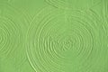 Close-up light green abstract background gypsum panel, spiral-shaped volumetric, green circles, futuristic background Royalty Free Stock Photo