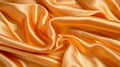 a close-up of a light orange satin fabric with a wavy texture Royalty Free Stock Photo