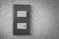 Close up of light switch with sunlight and shadow on white background, turn on and turn off, copy space, Royalty Free Stock Photo