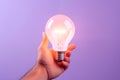 Close up a Lightbulb in a hand creative thinking concept new idea, innovation, brainstorming with copy space purple Generative AI Royalty Free Stock Photo