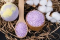 Close-up, lilac bath salt, in a wooden jar, in the form of a bomb and in a spoon, for relaxation Royalty Free Stock Photo