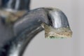 Close-up of limescale build-up. Selective focus on hard water deposit Royalty Free Stock Photo