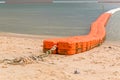 Close up line of sea buoys fasten on sea beach, marine equipment Royalty Free Stock Photo