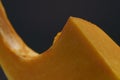 close-up of the lines of a piece of pumpkin on a black background