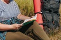 close up, Trailside Tranquility Overweight Woman Hiking Haven with Book and Backpack