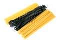 Close up of Linguine pasta Italian food in yellow and black colors isolated on white background with copy space Royalty Free Stock Photo