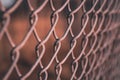 A close up of the links of a chain link fence using selective focus Royalty Free Stock Photo