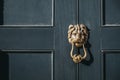 Close up of a lion`s head door knocker on a black door Royalty Free Stock Photo