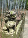 Close up of a lion stone statue in a park. Mythical creatures concept Royalty Free Stock Photo