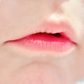 Close-up lips baby age one year, child mouth macro photo