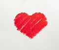 Close up of lipstick heart shape on white background.