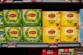 Close up of Lipton green tea and yellow label boxes on shelf. Royalty Free Stock Photo