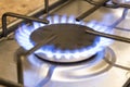 Close up lit gas hob burner Royalty Free Stock Photo