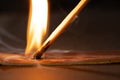 Close up of lit match with copy space on black background Royalty Free Stock Photo