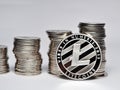 Close up coin stack and litecoin isolated on white blackground Royalty Free Stock Photo