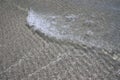 Close up littel wave on sand Royalty Free Stock Photo
