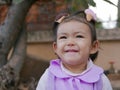 Close up of little Asian baby girl, smiling and being in a good mood Royalty Free Stock Photo