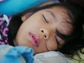 Close up of a little Asian baby girl`s lips a little opened while she was sleeping tight and comfortably Royalty Free Stock Photo