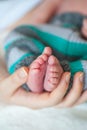 Close up of Little baby feet with mother hand Royalty Free Stock Photo