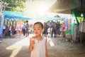 Little boy enjoy eating chocolate ice-cream cone while walking in the market Royalty Free Stock Photo