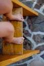 Close up of little boys legs at stairs in outdoor hot tub. Royalty Free Stock Photo