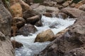 Close up of a little cascade falls of water over mountain river rocks Royalty Free Stock Photo