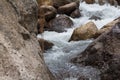 Close up of a little cascade falls of water over mountain river rocks Royalty Free Stock Photo