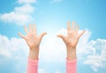 Close up of little child hands raised upwards Royalty Free Stock Photo