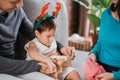 Close up of a little daughter opened a christmas present Royalty Free Stock Photo