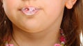 Close up little girl doing fun saliva bubbles Royalty Free Stock Photo