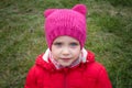 Close-up little girl face with a smile and beautiful blue eyes looking at the camera. Royalty Free Stock Photo