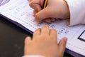 Close up on little girl hands doing school homework