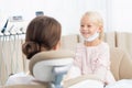 Close-up of a little girl having her teeth checked by unidentified doctor Royalty Free Stock Photo