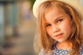 Close up little girl on porch of old ruined house. Royalty Free Stock Photo