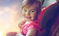 Close up of little girl sitting in baby car seat Royalty Free Stock Photo