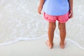 Close up of little girl standing at beach Royalty Free Stock Photo