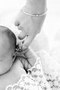 Close-up little hand of child and palm of mother. A newborn holds on to mom's finger. Royalty Free Stock Photo