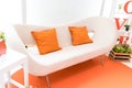 Close up living room display in orange theme.