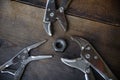 Close up locking pliers on wooden background, Hand tools in work shop