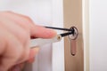 Lockpicker Hand Fixing Door Handle At Home