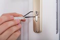 Lockpicker Hand Fixing Door Handle At Home
