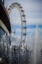 Close up of the London Eye and fountains from the South bank, London, UK