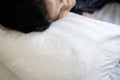 Close-up,Long black hair loss on pillow,hair fall disease or scalp problem,asian woman sleeping on the bed,female patient with Royalty Free Stock Photo