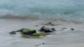 Close Up long exposure of and ocean wave on the sand Royalty Free Stock Photo