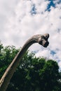 Close-up of a long-necked dinosaur. Stylized brachiosaurus made of rubber, paint and metal. Animatronics and robotics for children