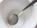Close up long silver spoon in white empty coffee cup. Royalty Free Stock Photo