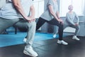 Close up look on retired women lunging at fitness club Royalty Free Stock Photo